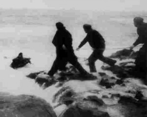 Crewman being pulled ashore Crewman being pulled ashore